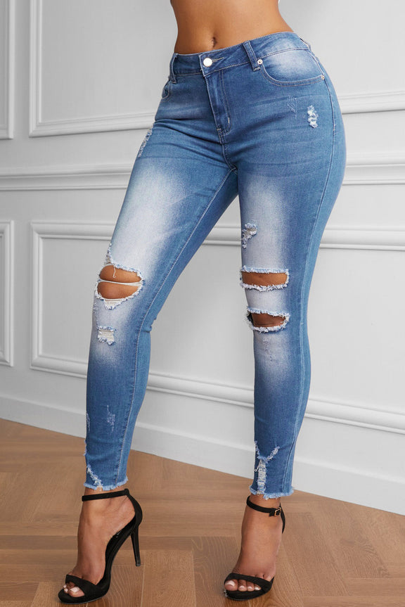 Women's Faded Mid High Rise Holes Skinny Jeans